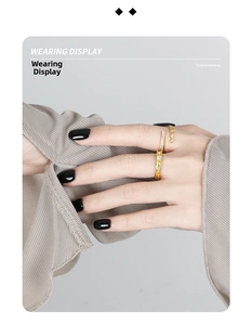 Detail view of gold layered ring set with cubic zirconia on female model hand