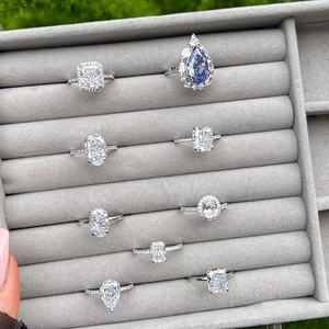 Luxurious S925 sterling silver rings with teardrop and cushion cut zircon in a velvet box