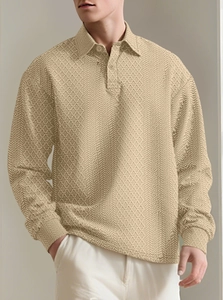 Close-up of khaki long sleeve polo shirt featuring geometric jacquard texture and buttons