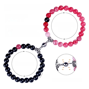 Detail showing 8mm natural stone beads and magnetic heart closure on couple bracelets
