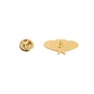 Detailed back view of a golden butterfly-shaped alloy badge with pin and metal clutch
