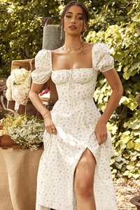 Detail of floral puff sleeve maxi dress with square neckline and romantic slit design