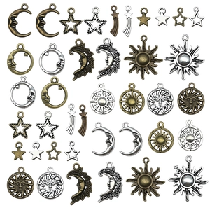 Set of celestial alloy charms featuring sun moon and star designs in bronze and silver
