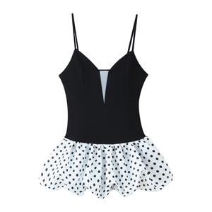 Sleeveless deep V-neck dress with black mesh stitching and white polka dot pleated skirt