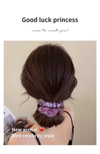 Purple mesh scrunchie with lavender flowers and pearls shown on a ponytail