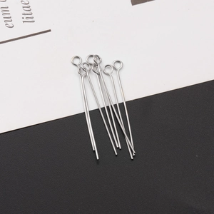 Detailed macro view of silver stainless steel eye pins for DIY handmade jewelry crafts