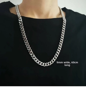 Detail view of 9mm wide and 60cm long silver stainless steel cuban link chain for men