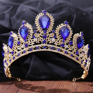 Detailed close-up of golden bridal crown featuring elegant blue gemstones and rhinestones
