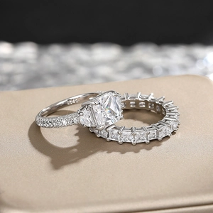 Macro detail of silver ring set with square centerpiece and round zircon pavé stones