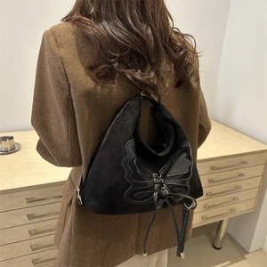Retro black suede tote bag with butterfly embroidery and ribbon detail for women