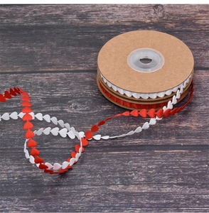 Close-up of red and white heart-shaped ribbon rolls for DIY bouquet decoration
