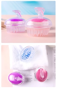 Detailed view of ergonomic scalp massage brushes in pink, purple, and blue pastel colors