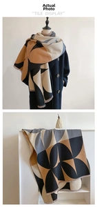Detail of color-block geometric pattern shawl with fringe on a warm pashmina scarf