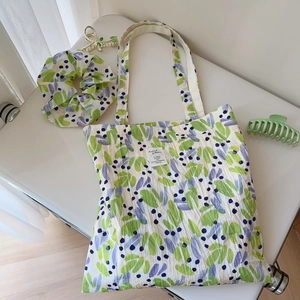 Matching floral cotton tote bag and scrunchie set with green leaves and purple prints