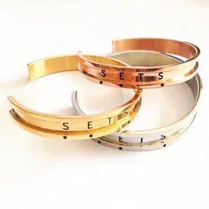Polished stainless steel C-shape open bracelets in gold, silver, and rose gold finishes