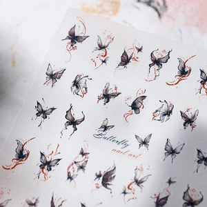 Retro ink-style butterfly nail art stickers with vintage artistic patterns on white base
