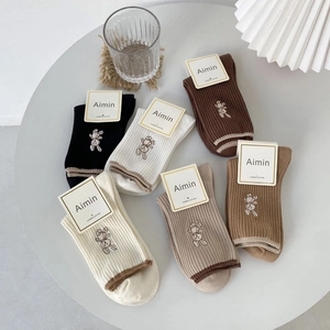 Set of six earth-toned combed cotton crew socks with minimalist rabbit embroidery