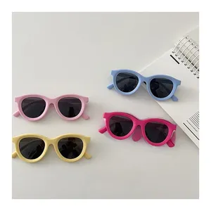 Flat lay of colorful children's polarized sunglasses with soft matte silicone frames
