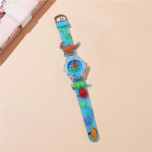 Detail of blue silicone kids' watch with 3D cartoon dinosaur decorations and clear dial