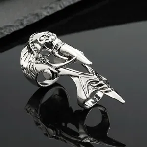 Macro shot of punk skull and sharp claw armor ring with vintage silver finish metal details