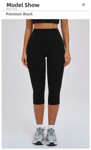 Front view of black high-waisted yoga capri leggings with wide compression waistband