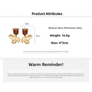 Detailed specs of resin goldfish earrings with crystal accents and 4x3cm size info