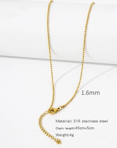 Detailed view of 1.6mm gold bead chain in 316 stainless steel with lobster clasp