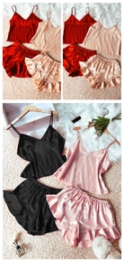 Close-up of silk satin camisole pajama sets with ruffle shorts in multiple colors