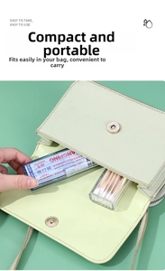 Portable cotton swab and bandage storage box inside a green leather handbag pouch