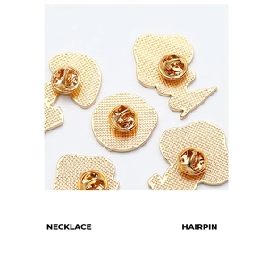 Macro shot of gold butterfly clutch back pins for mushroom brooch enamel pins