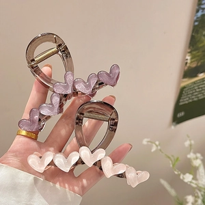 Chic acrylic heart hair claw clips in pastel purple and pink with pearlescent finish