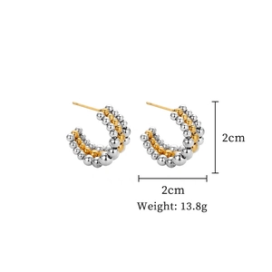 Detail of 2cm diameter two-tone titanium steel C-hoop earrings weighing 13.8g