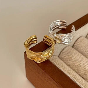 Irregular textured S925 sterling silver open rings in gold and silver finish on wood