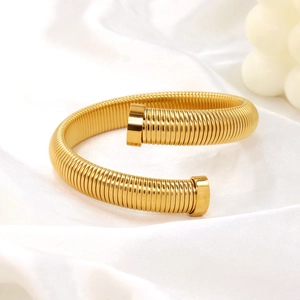 Minimalist gold-plated stainless steel Tubogas spring bracelet with spiral texture