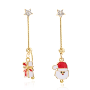 Detailed view of asymmetric gold-tone Christmas earrings with Santa and star tassels