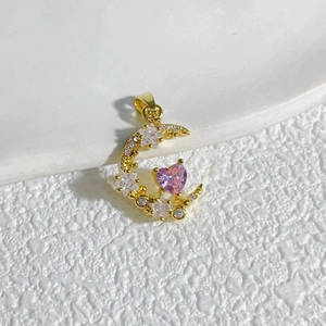 Detail of 18K gold-plated crescent pendant with pink heart zircon and crystal inlay