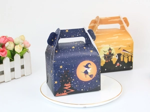 Detail view of Halloween treat boxes with witch and reaper prints and carry handles