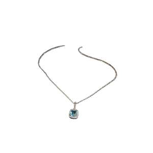 Exquisite gold necklace featuring a square blue stone pendant with halo diamond setting