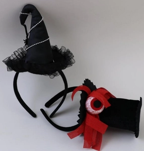 Detail of Halloween headbands with black witch hat and spooky eyeball mesh design