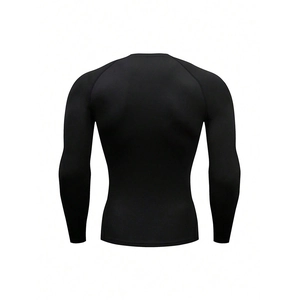 Detail view of black compression shirt back showing seamless elastic quick-dry fabric texture