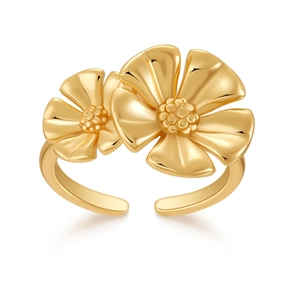 Close-up of dual 18K gold plated flower rings with polished petals and textured center