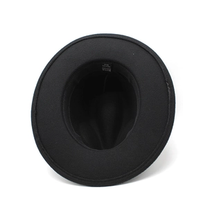 Detail view of the 57cm size label and 100% polyester material tag inside the fedora