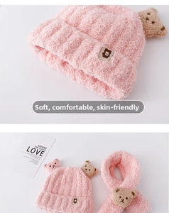 Detailed texture of pink plush knit hat and scarf set with cute 3D bear decorations