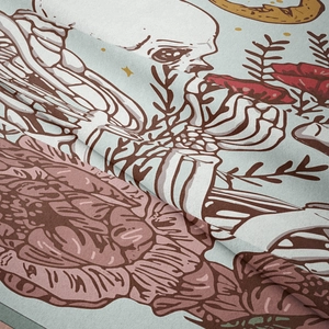 Macro shot of bohemian skull and rose floral pattern on soft fabric tapestry texture