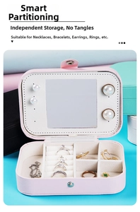 Pink PU leather jewelry box detail with mirror and slots for rings and earrings