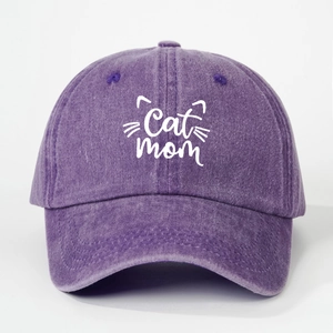 Detailed view of Cat Mom embroidery on purple washed vintage style baseball cap