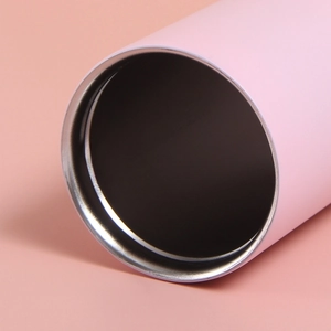 Detail view of pink insulated travel mug showing smooth stainless steel inner rim