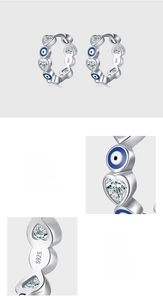 Dettaglio di orecchini S925 in argento con occhio blu e zircone cubico a cuore