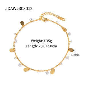 Detail of 18K gold stainless steel anklet showing K18 stamp and crystal pendant size