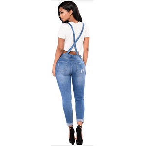 Women's ripped denim overalls in blue with slim straight fit and cross-back straps